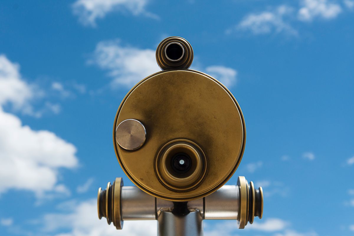 Microscope vs telescope: a telescope's large objective lens gathers light from distant objects, the opposite of a microscope