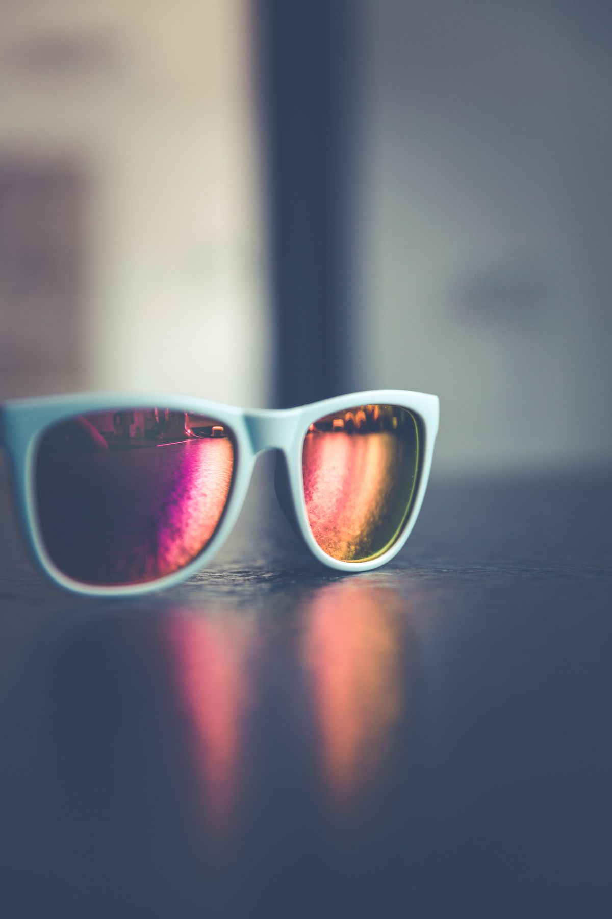 Close-up of reflective sunglasses demonstrating s-polarized glare blocked by polarized lenses
