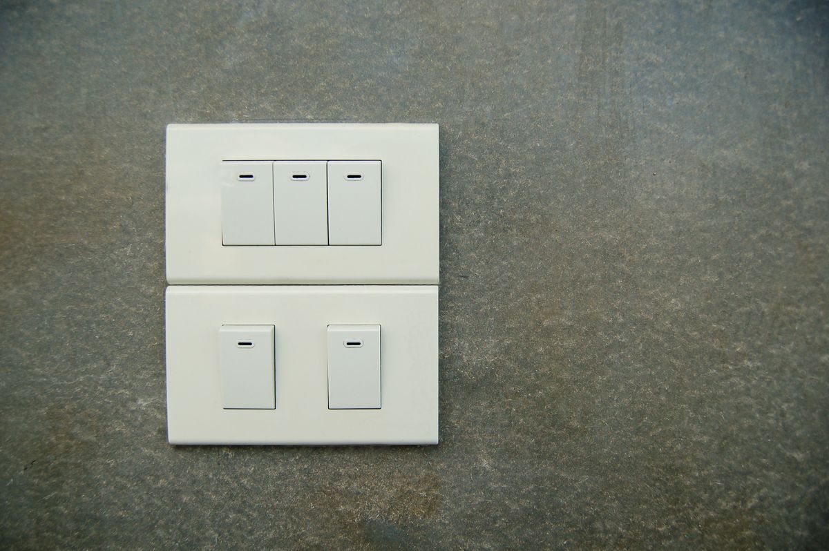 Two rocker switches on a wall, used for two-way switching of one light