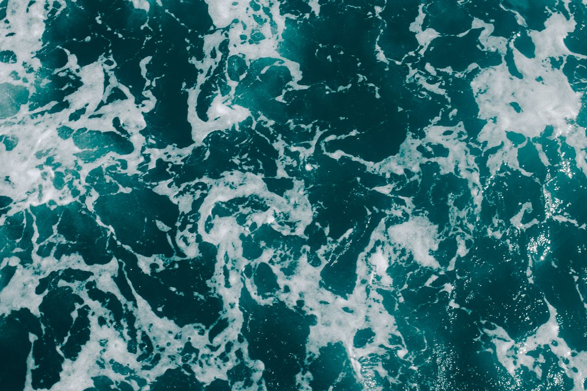 Aerial view of ocean waves, a picture of the wave nature of light