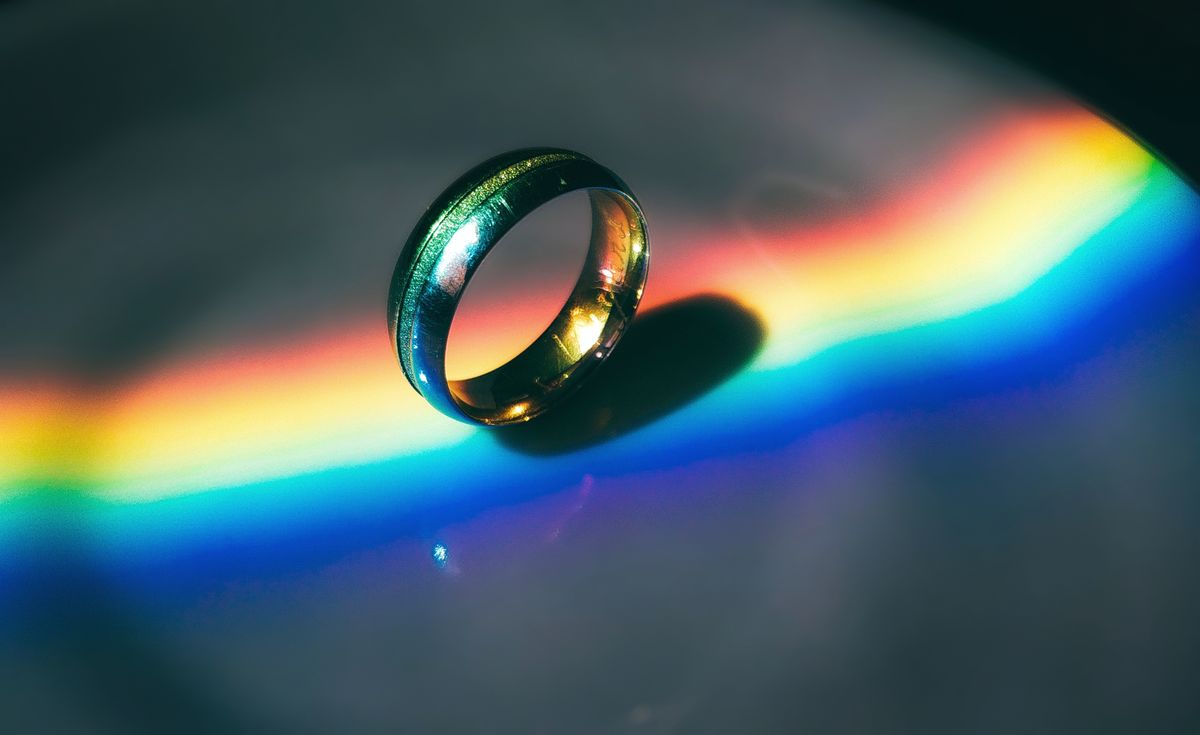 Laser diffraction pattern through a grating showing sharp spectral lines of different colours