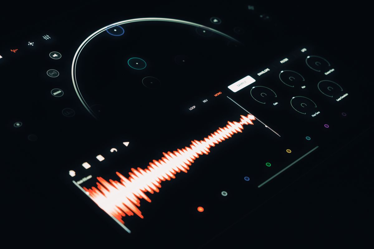 Close-up of a digital audio interface displaying a vibrant sound wave and control elements, visualising the audio frequency spectrum and wave behaviour