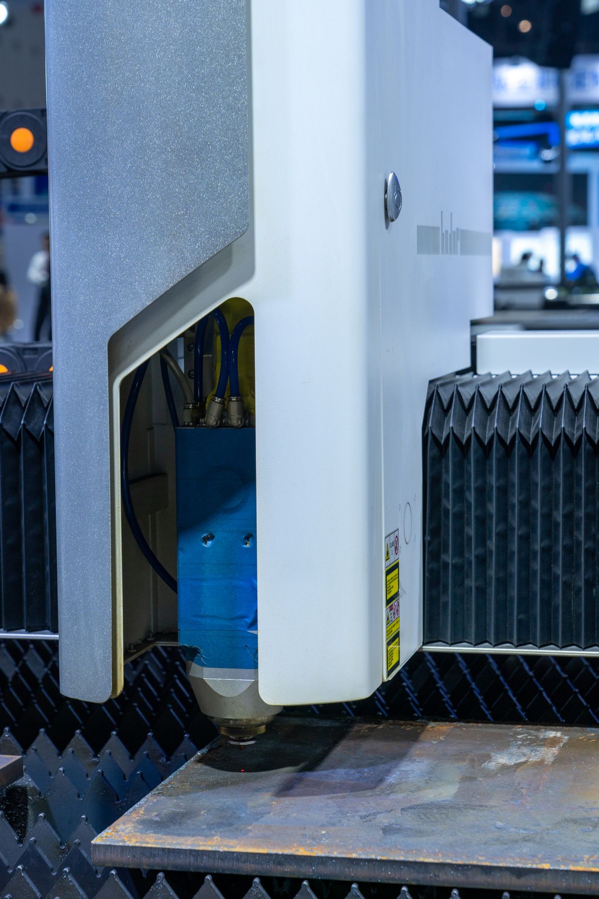 Close-up of a modern laser cutting machine used in industrial manufacturing processes, showing what are lasers used for in industry