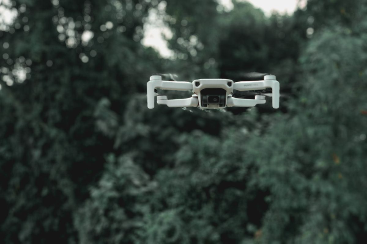fiber optic cables used for drone technology and military applications with unmanned aerial vehicle in flight