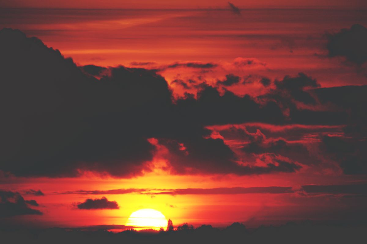 A dramatic red sunset, blue light scattered away over the long path