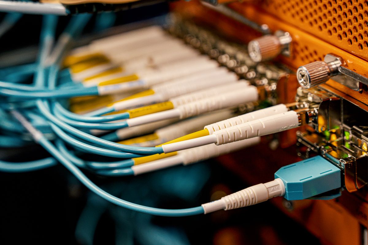 Optical switch equipment with fiber optic connectors and cables showing the outer jackets and connector construction