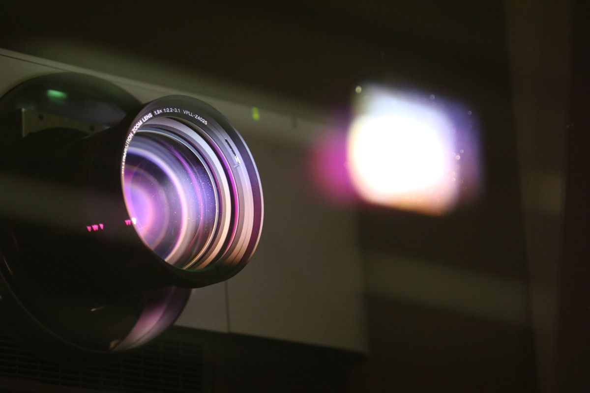 The optics lens maker formula in action: light passing through a multi-element projector lens