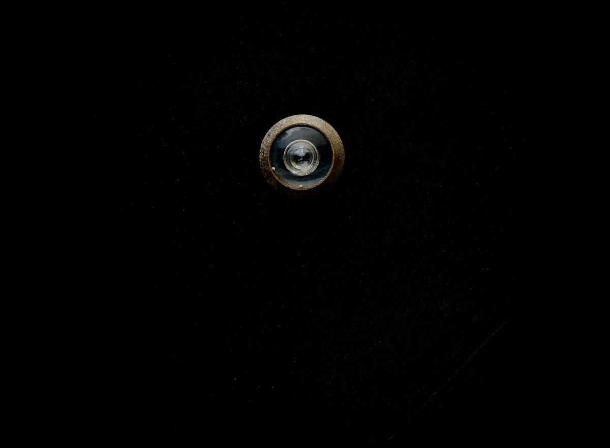 Concave lens used in a door peephole showing a wide-angle view of the outside
