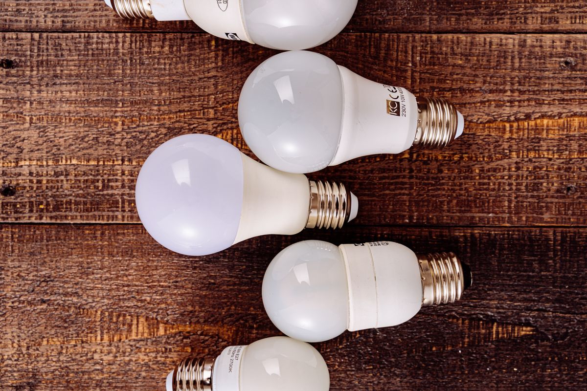 LED light bulbs on a wooden surface, measured in lumens not watts