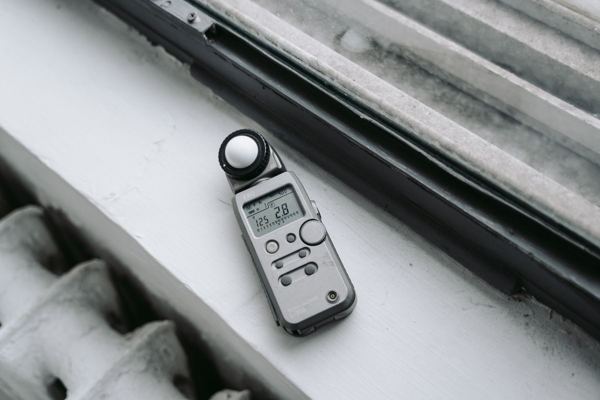 A digital light meter on a windowsill, a tool for how light is measured