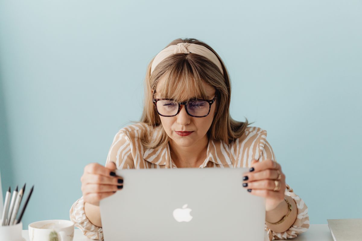 A person working at a laptop, where good habits beat blue light glasses for eye strain