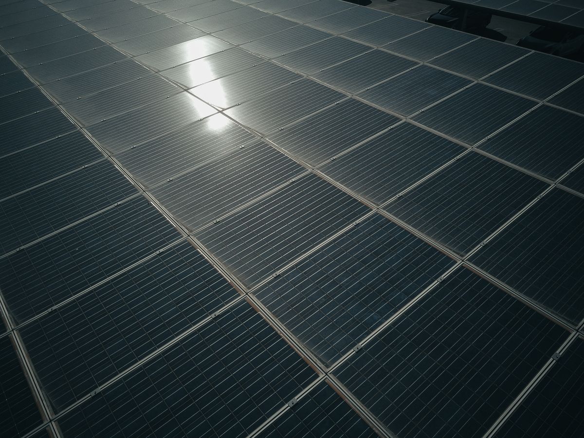 Close-up of solar panels capturing sunlight, demonstrating how absorption of light is converted into usable energy